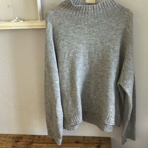 A bound turtle neck sweater 
Size XL